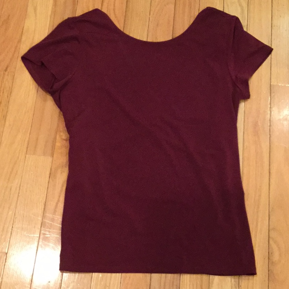NWT Express burgundy maroon blouse with wrap v in back. Size small.